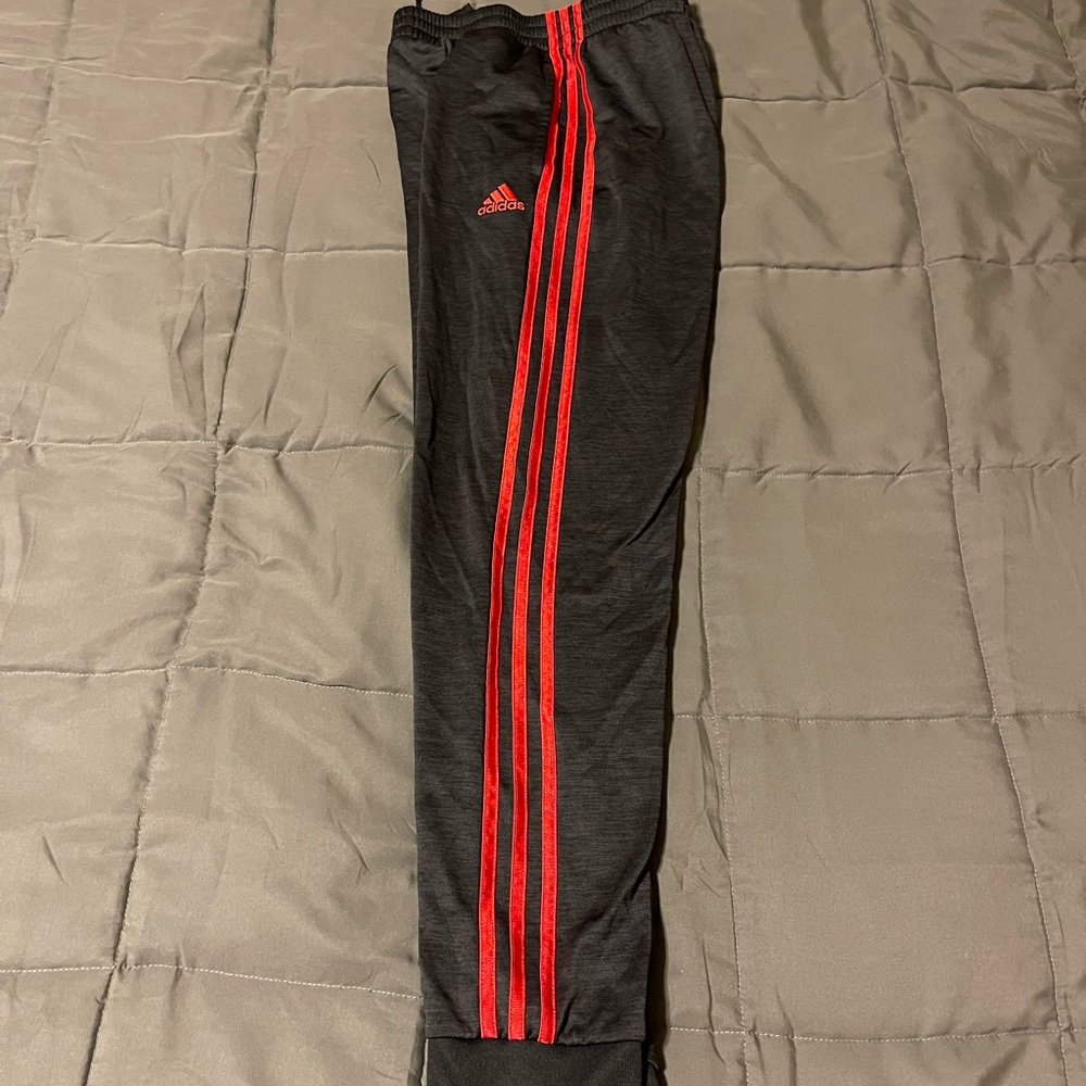 Black and red adidas joggers